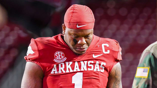 Razorbacks quarterback KJ Jefferson walks off field after loss to Auburn